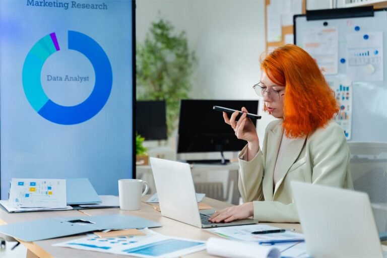 woman at desk working talking with ai voice agent